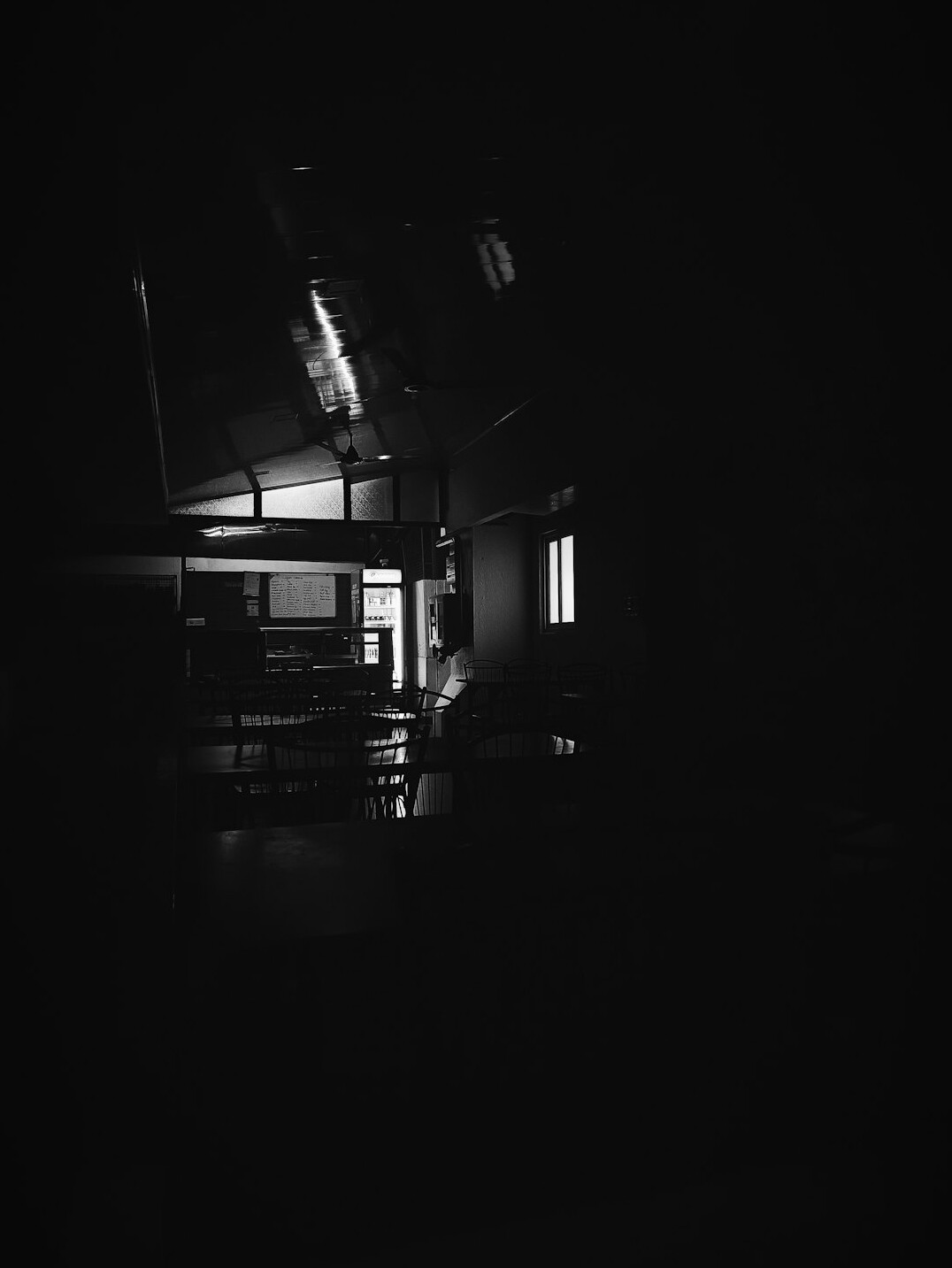 person using smartphone in dark room