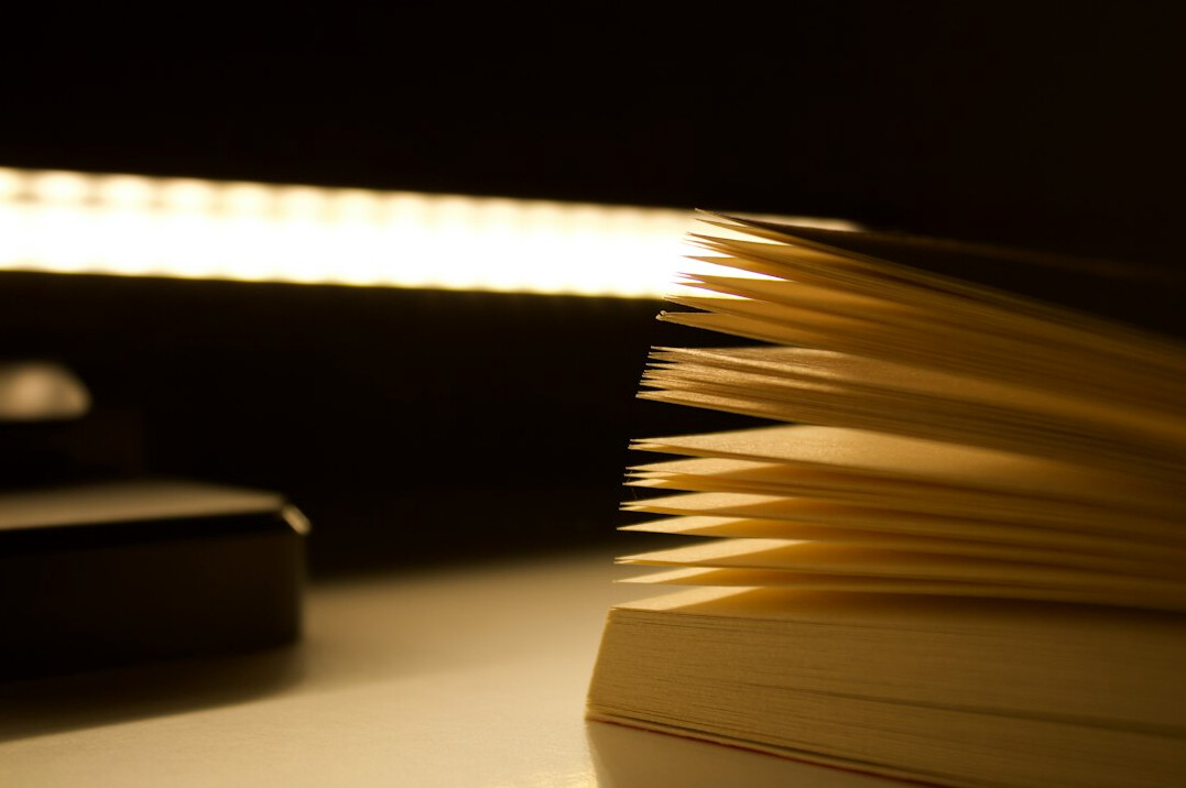 open book with dim lamp